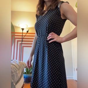 Black patterned, v neck dress. Perfect for business attire or dress up or down